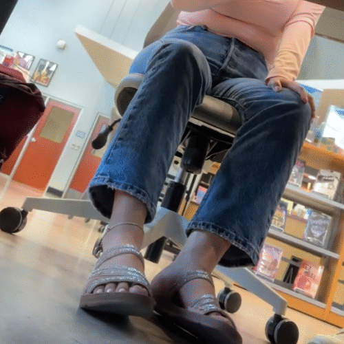 Latina Girl in Sandals while talking to friend